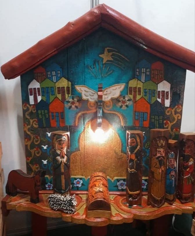 The same oratório with its light on, in another setting, with the nativity figures arranged differently